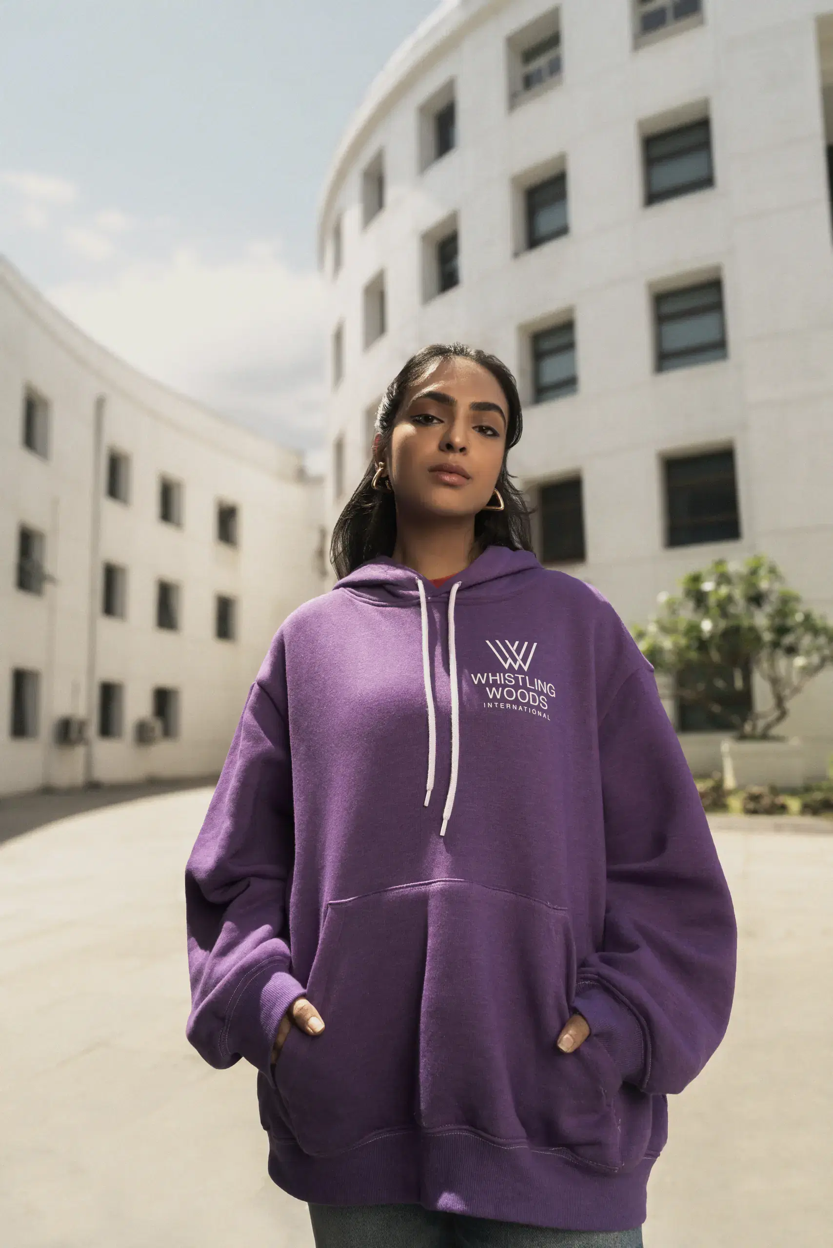 Whistling Woods International student in a purple college hoodie on campus